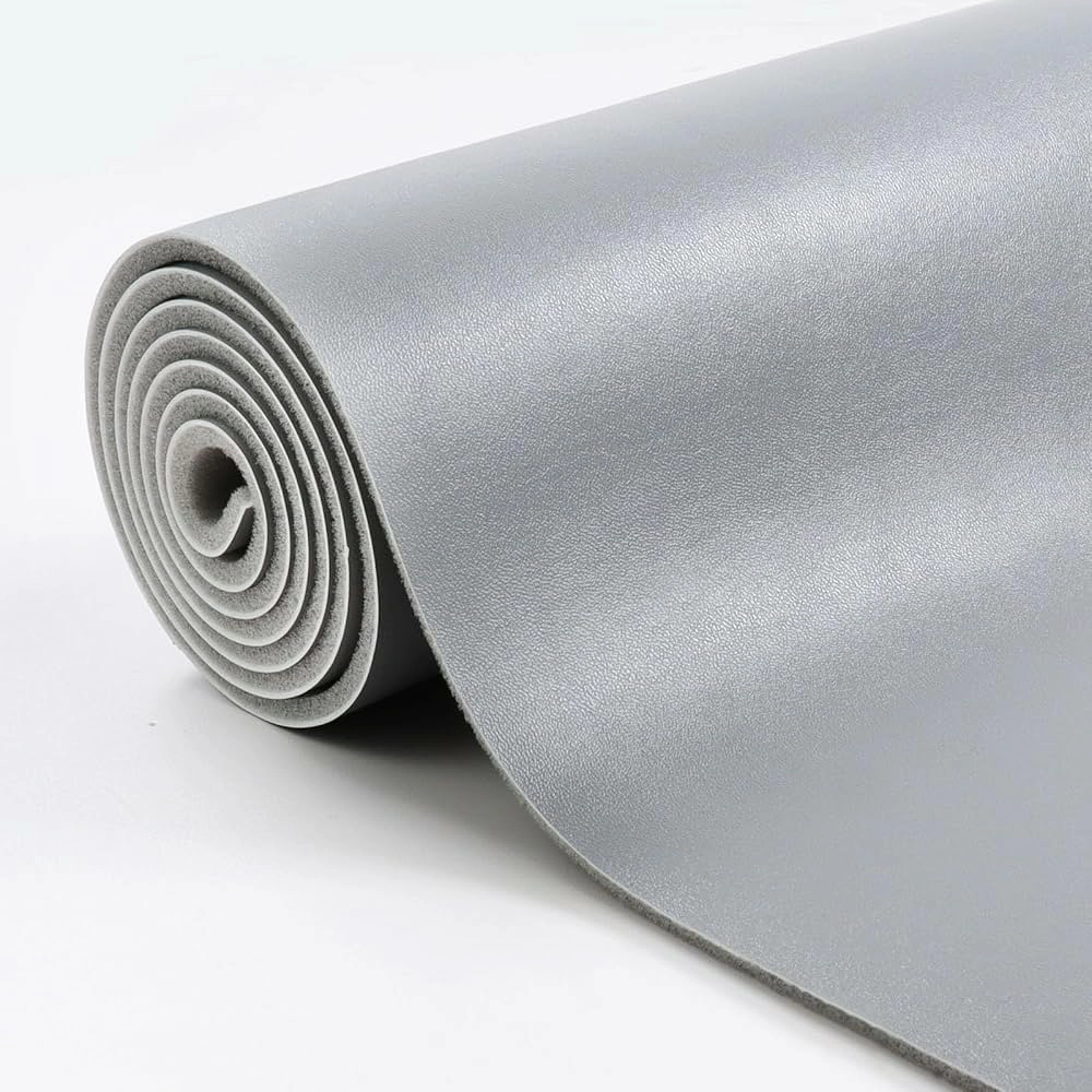 Close-up PU synthetic leather sample showing coated surface, flexible edge and textile backing