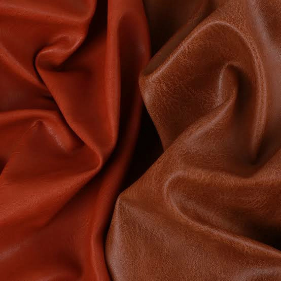 Black PU leather swatches showing different matte, satin and glossy reflections for jacket design