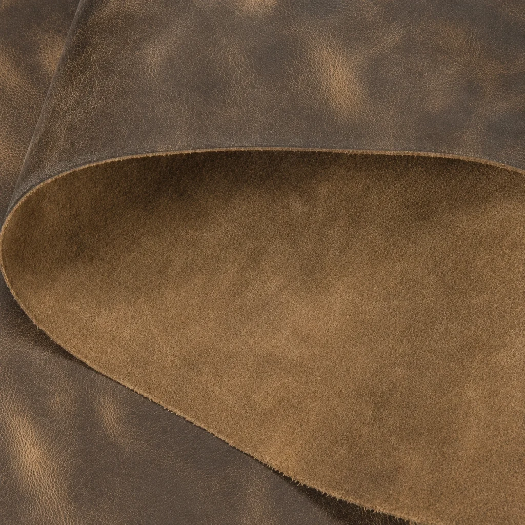 Close-up of PU synthetic leather showing coated surface cut edge and textile backing