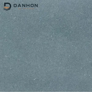 Close-up of blue-grey TPU leather material with a fine directional nubuck-like surface texture