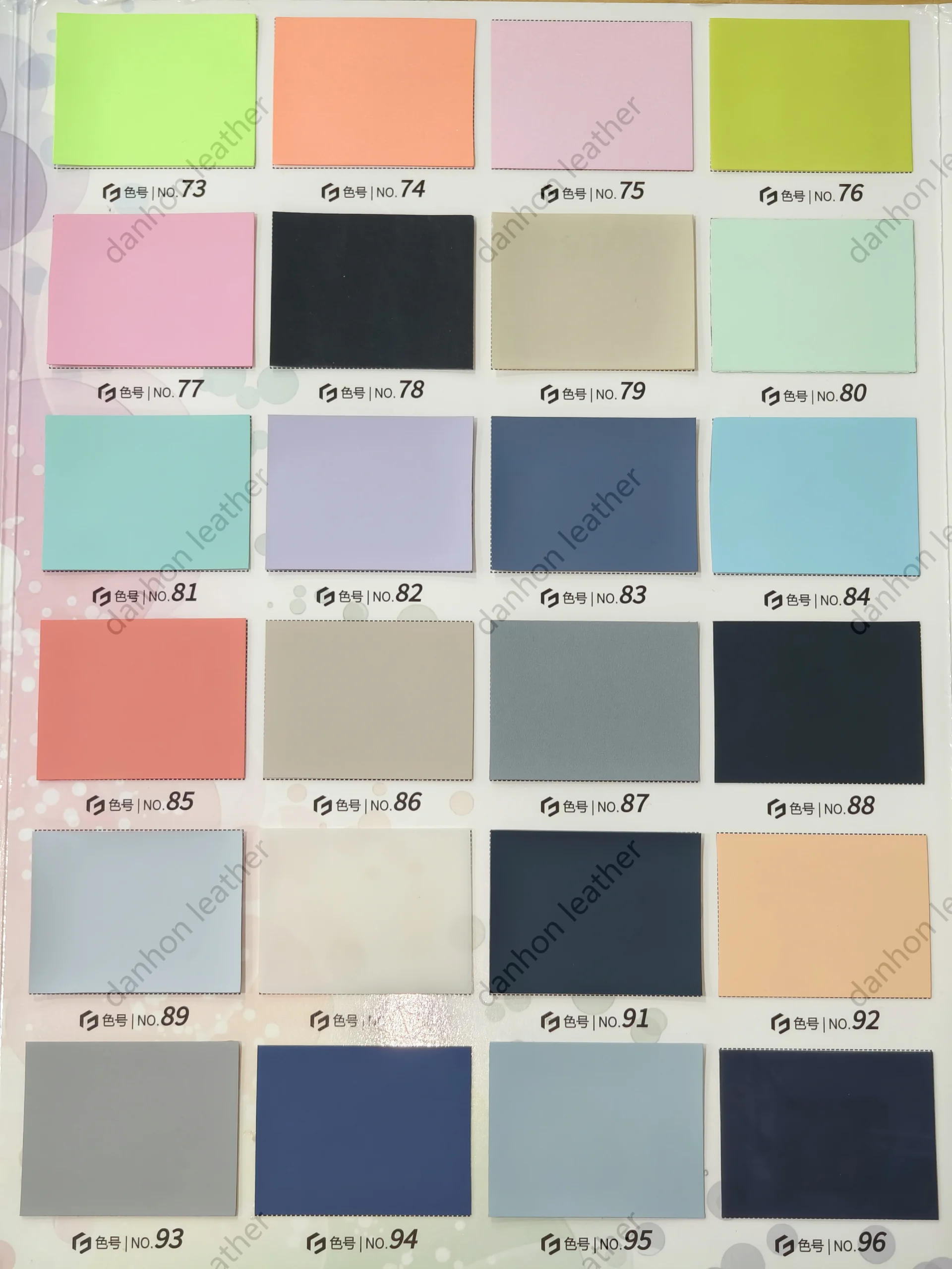 TPU leather color card showing numbered swatches No.73 to No.96 including lime, coral, pink, mint, lavender, blue, grey and neutral tones